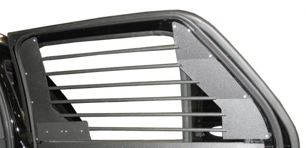 Exterior close-up of the horizontal tubes and textured end panels spanning the rear side glass