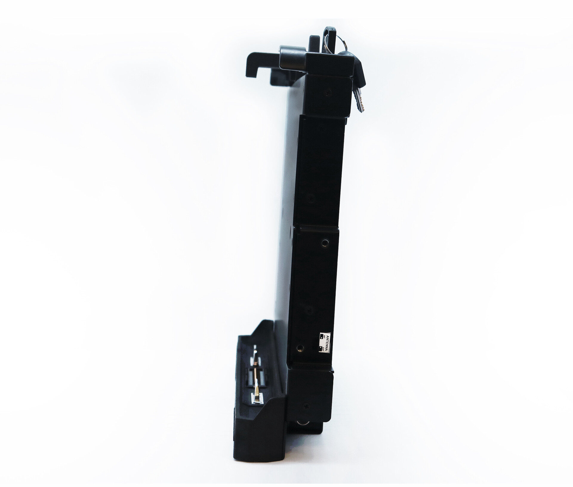 Narrow side profile with the key standing out of the lock at the top and the connector at the foot