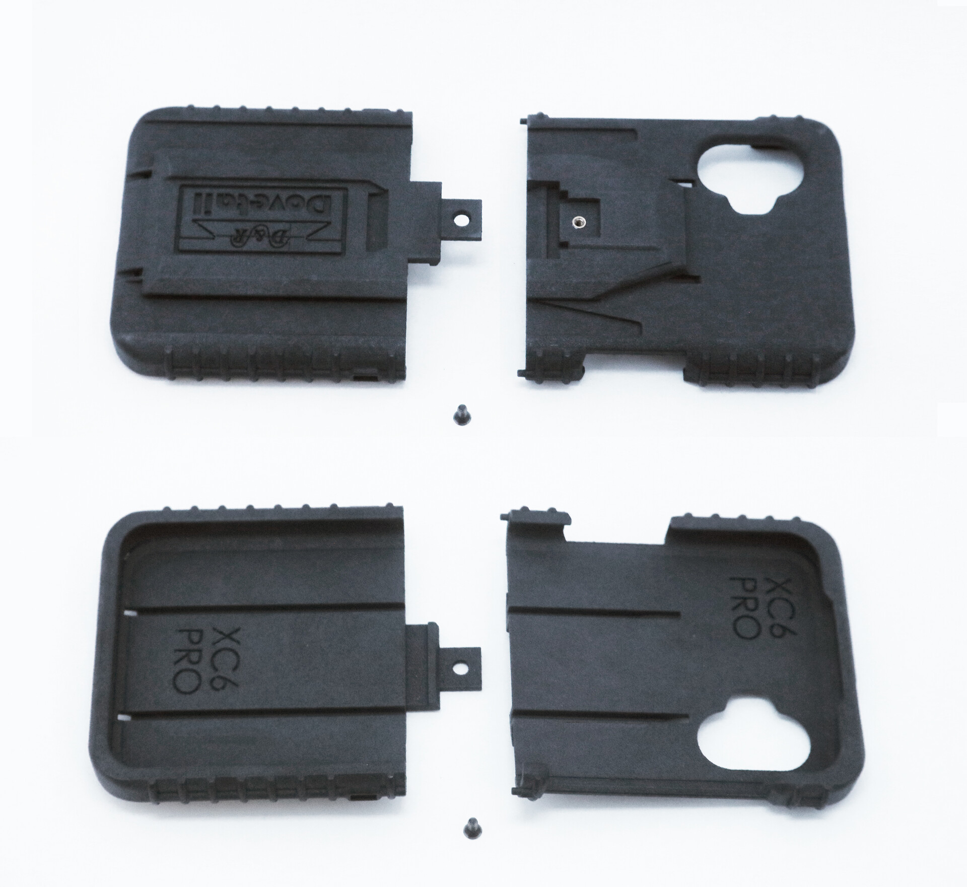 All four molded parts and two mounting screws laid out flat, dock face above, phone cavity below