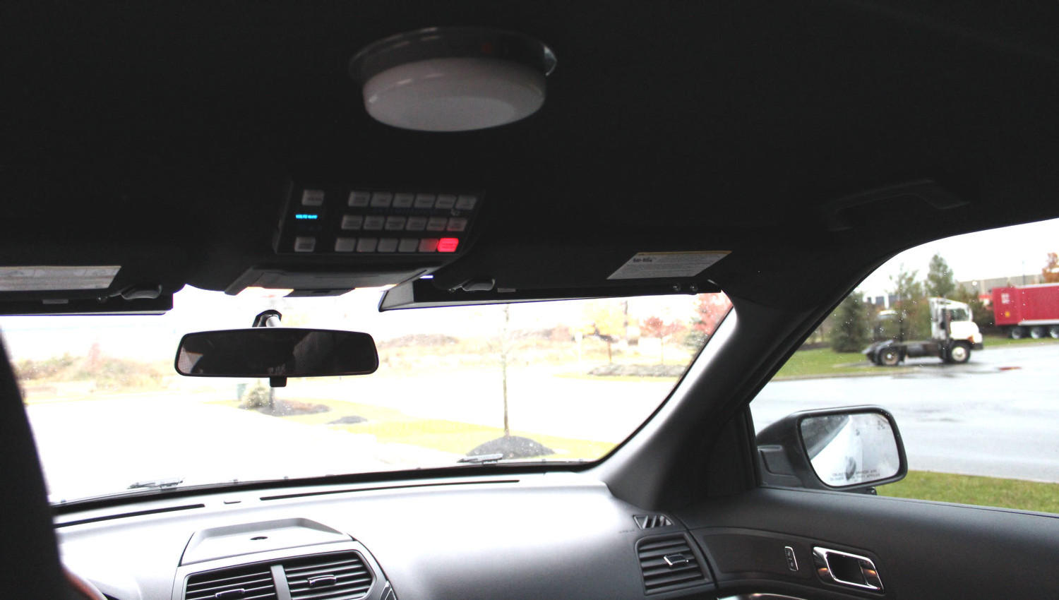 View from the rear seat of an Explorer with the visor bar and control keypad mounted at the headliner