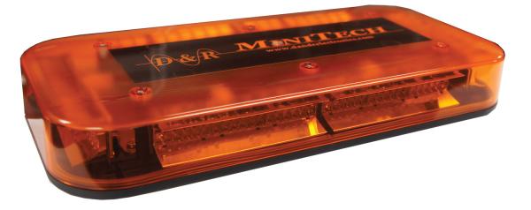 Three-quarter view of the unlit amber minibar with the MiniTech name and website across the centre panel