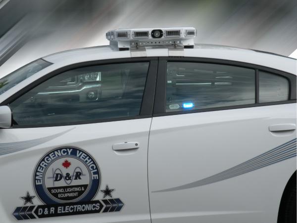 Optional MR6 linear LED lit blue in the rear window of a white Charger with D&R door decal