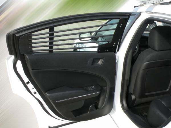 Rear door open on a Charger, showing the horizontal bar set fitted inside the door glass